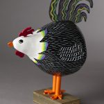 Whimsical painted chicken statue 